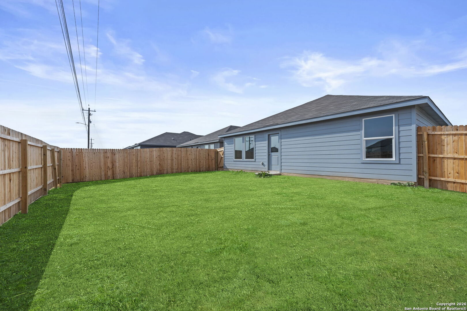 1835 Nuthatch Ridge New Braunfels, TX 78130 - Photo 22 of 23 a view of a backyard with wooden fence