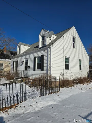 a front view of a house with a wooden fence