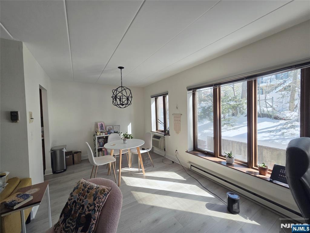 150 County Road, Unit 18 Tenafly, NJ 07670 - Photo 8 of 15 a living room with furniture and a large window