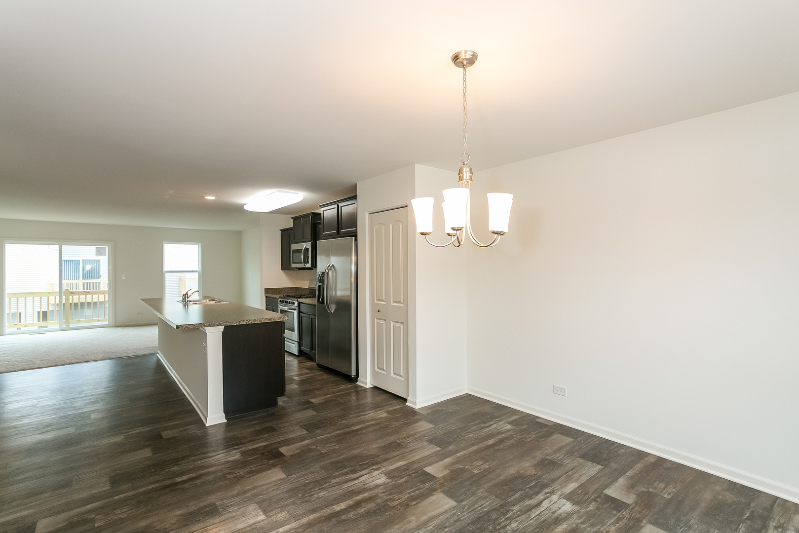 2364 Upland Road, Unit 2265 Pingree Grove, IL 60140 - Photo 5 of 18 a view of a dining room with furniture window and wooden floor