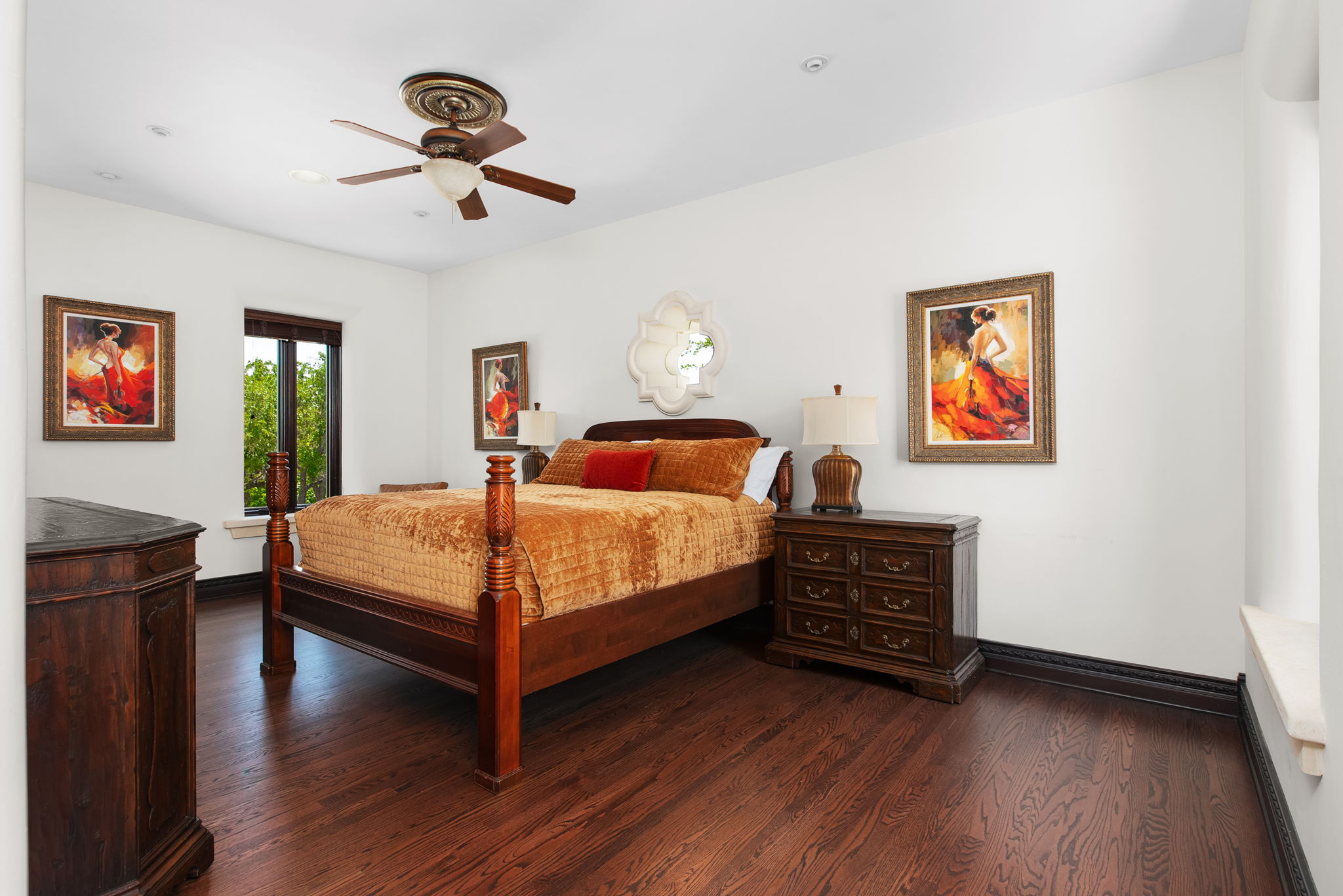 4256 Fischer Store Road Wimberley, TX 78676 - Photo 30 of 40 a bedroom with a bed and wooden floor