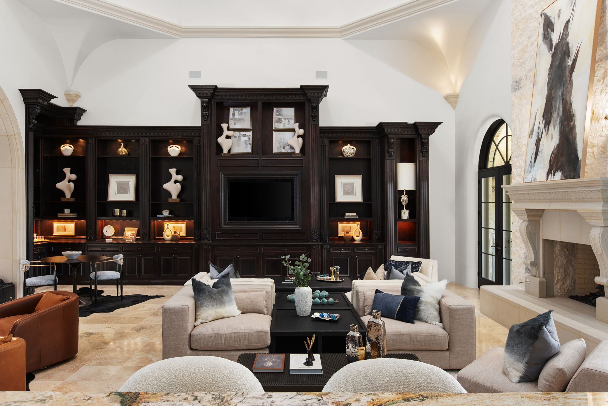 4256 Fischer Store Road Wimberley, TX 78676 - Photo 5 of 40 a living room with furniture a fireplace and lots of windows