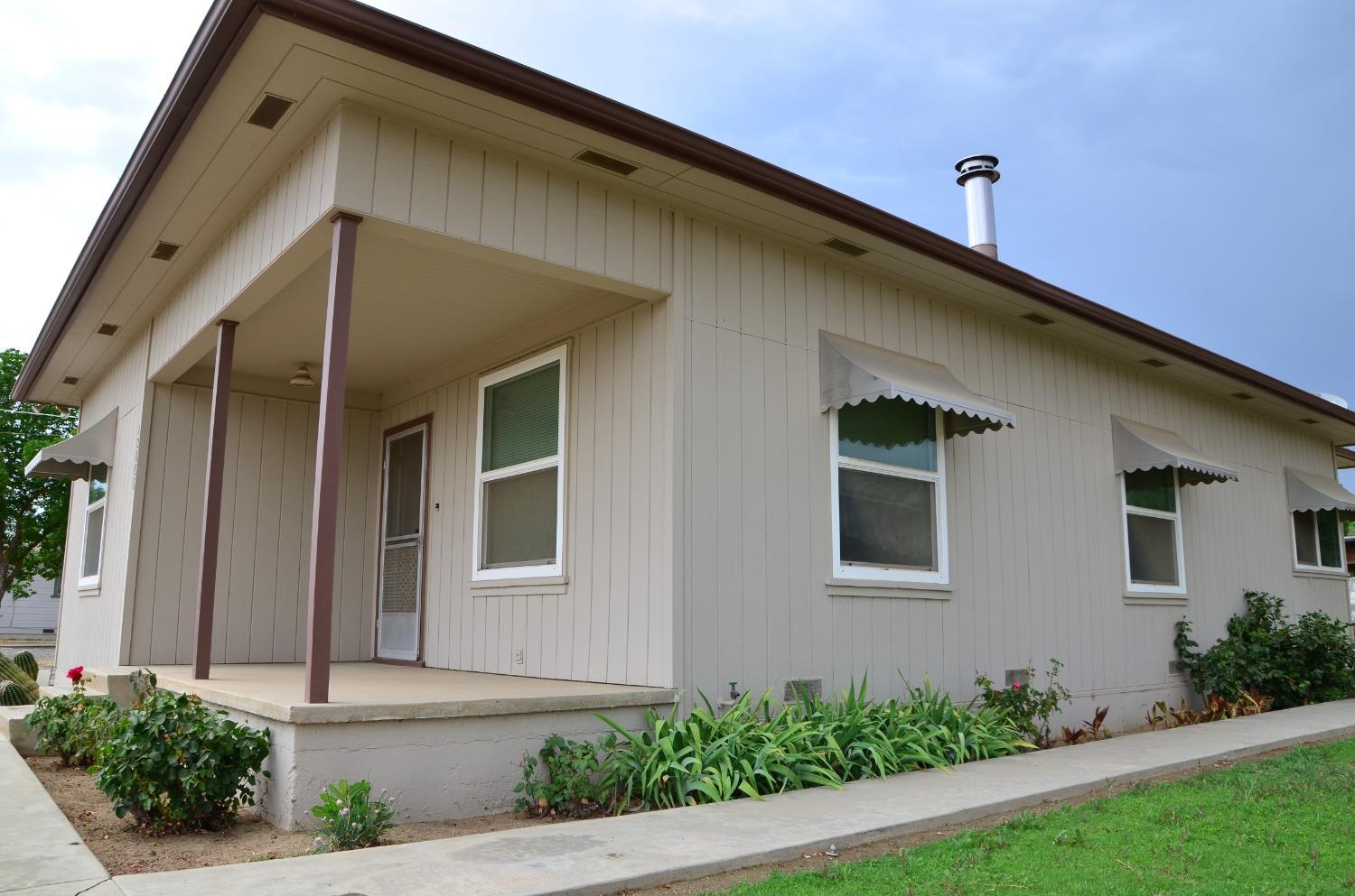 10888 Ave 412 Dinuba, CA 93618 - Photo 4 of 15 a front view of a house with stairs