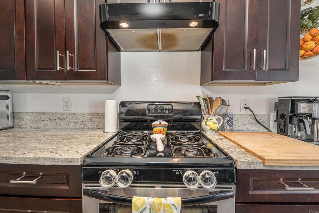 4159 Baycliff Way Oceanside, CA 92056 - Photo 11 of 23 a stove top oven sitting inside of a kitchen