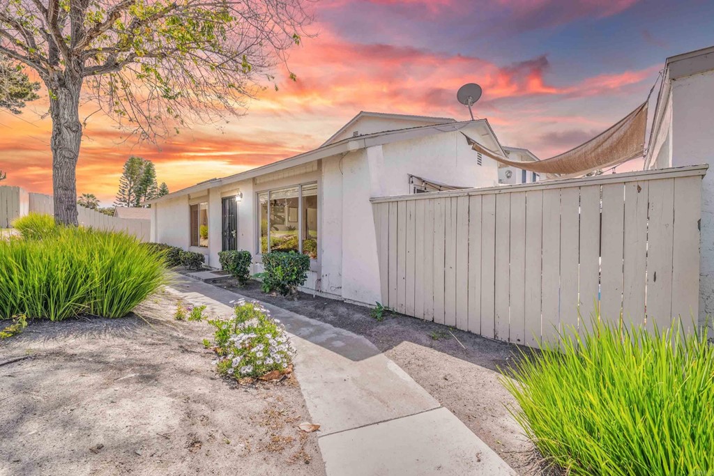 4159 Baycliff Way Oceanside, CA 92056 - Photo 2 of 23 a view of a house with a small yard and plants