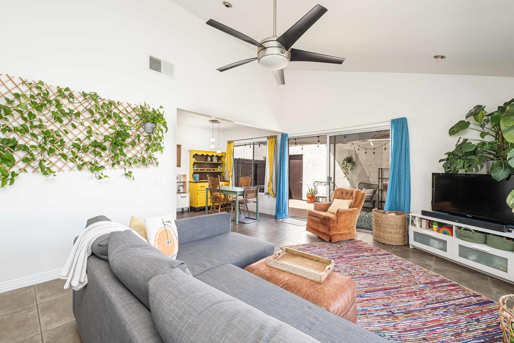 4159 Baycliff Way Oceanside, CA 92056 - Photo 4 of 23 a living room with furniture and a flat screen tv
