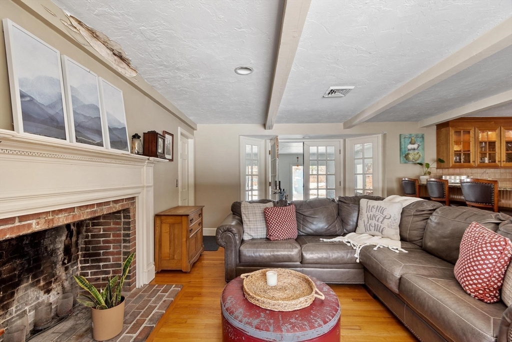 92 Prospect Street Lunenburg, MA 01462 - Photo 20 of 42 a living room with furniture and a fireplace