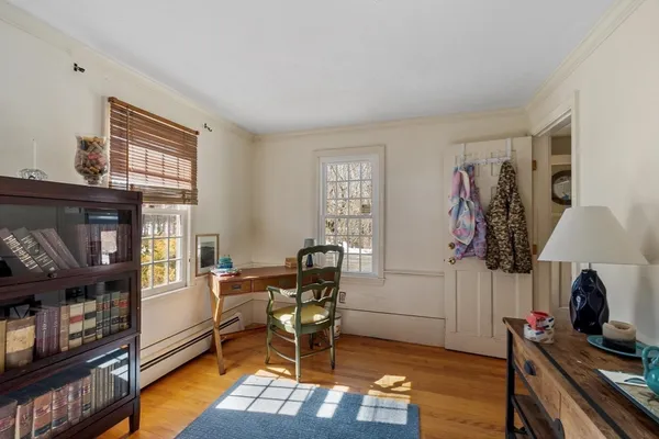 a view of a livingroom with furniture and a window