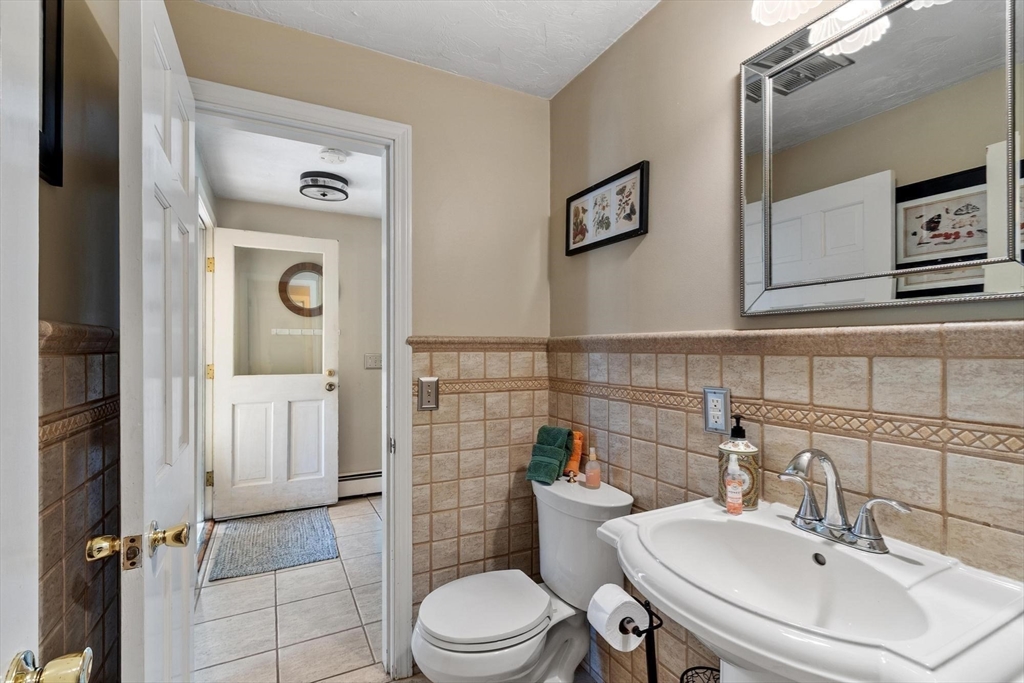 92 Prospect Street Lunenburg, MA 01462 - Photo 24 of 42 a bathroom with a sink toilet and shower