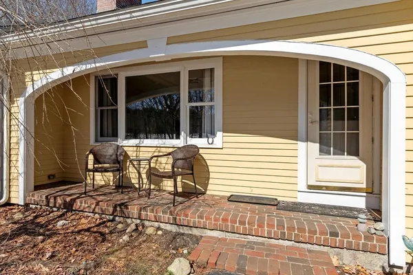 a view of a house with a large window and wooden floor