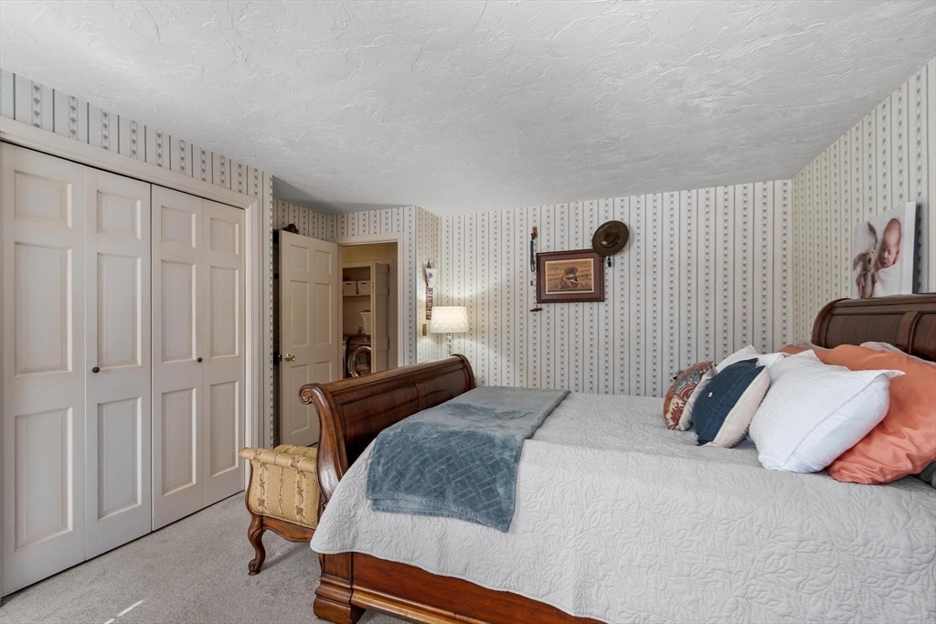 92 Prospect Street Lunenburg, MA 01462 - Photo 32 of 42 a bedroom with a bed and a window