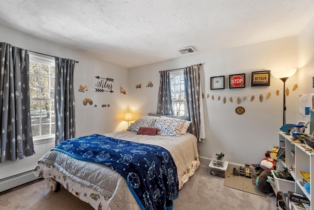 92 Prospect Street Lunenburg, MA 01462 - Photo 33 of 42 a bedroom with a bed and a window