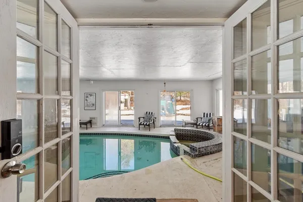 a kitchen with counter top space and windows