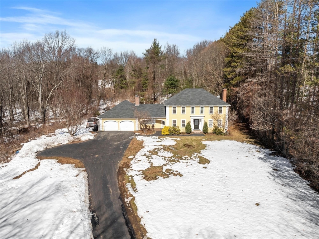 92 Prospect Street Lunenburg, MA 01462 - Photo 41 of 42 a view of a yard with a snow on the road