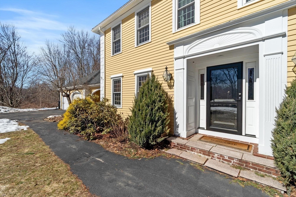 92 Prospect Street Lunenburg, MA 01462 - Photo 5 of 42 a front view of a house with a yard