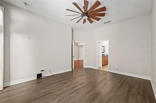a bathroom with a tub a sink and mirror