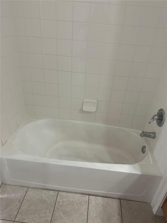 6157 Metrowest Boulevard, Unit 304 Orlando, FL 32835 - Photo 12 of 13 a close view of a bathtub in a bathroom