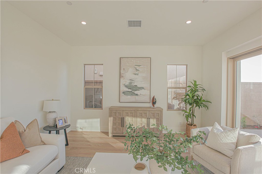 137 Oakstone Irvine, CA 92618 - Photo 13 of 23 a living room with furniture and a potted plant