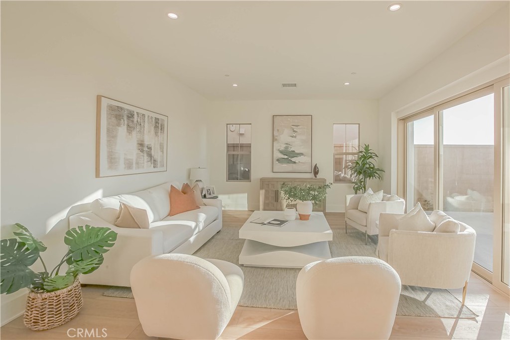 137 Oakstone Irvine, CA 92618 - Photo 14 of 23 a living room with furniture and a large window