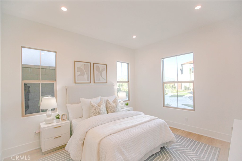 137 Oakstone Irvine, CA 92618 - Photo 9 of 23 a bedroom with a bed and a window