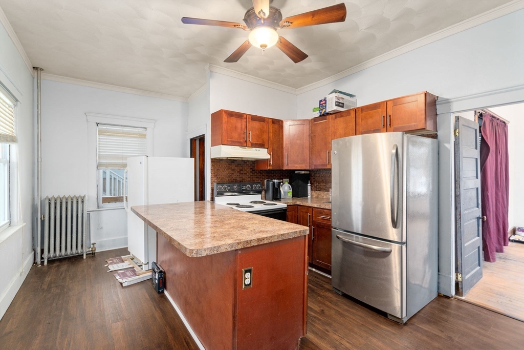 3 Park Street Webster, MA 01570 - Photo 11 of 19 a kitchen with a refrigerator a sink and a refrigerator