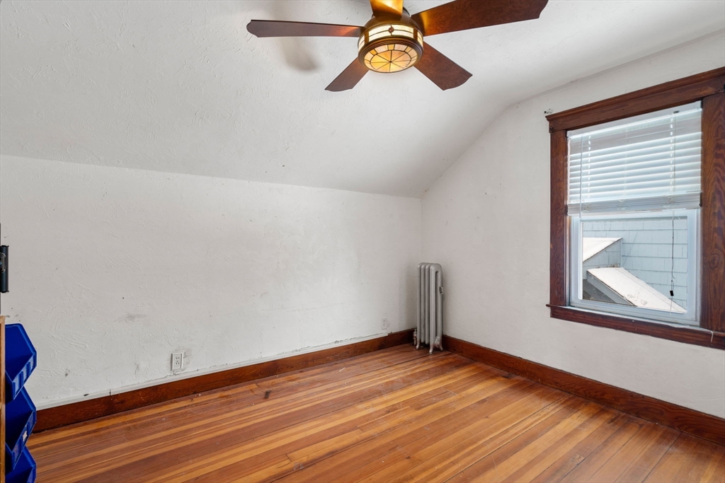 3 Park Street Webster, MA 01570 - Photo 5 of 19 an empty room with wooden floor cabinet and windows