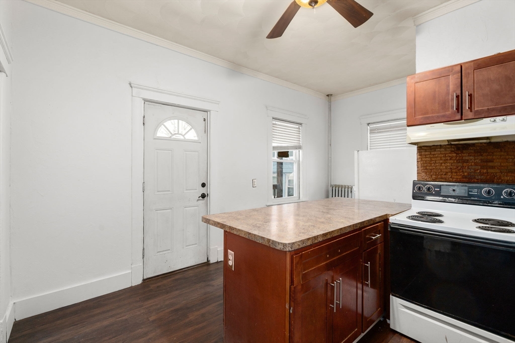 3 Park Street Webster, MA 01570 - Photo 10 of 19 a kitchen with a stove cabinets and wooden floor