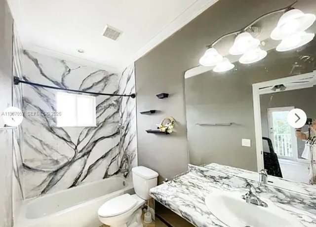 a view of living room with furniture and a window
