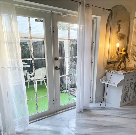 a view of livingroom with furniture and floor to ceiling window