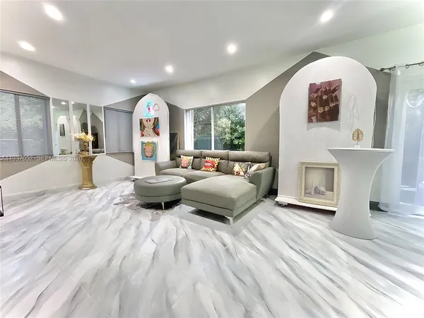 a bedroom with furniture and a fireplace