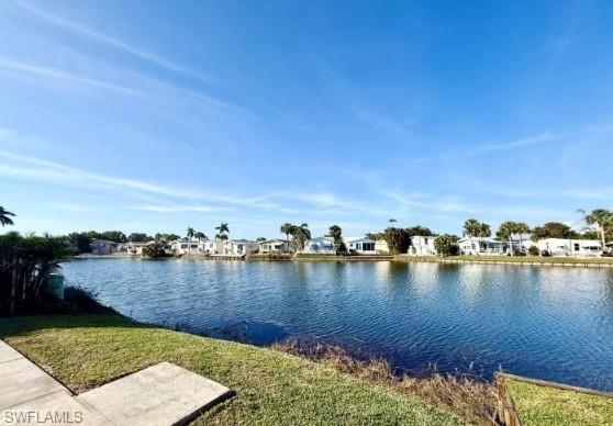 447 Cheetah Drive Naples, FL 34114 - Photo 6 of 42 a view of a lake with houses