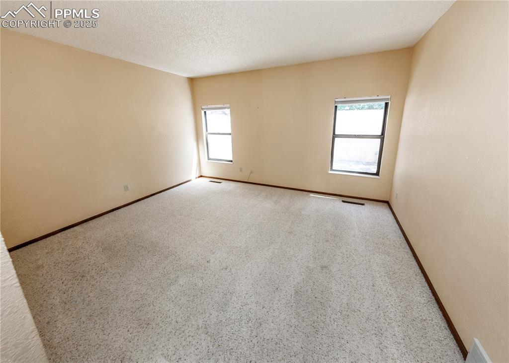 55 Bonnymede Road, Unit S Pueblo, CO 81001 - Photo 11 of 24 an empty room with windows