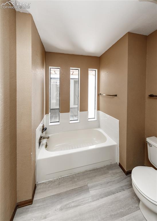 55 Bonnymede Road, Unit S Pueblo, CO 81001 - Photo 16 of 24 a spacious bathroom with a bathtub and toilet