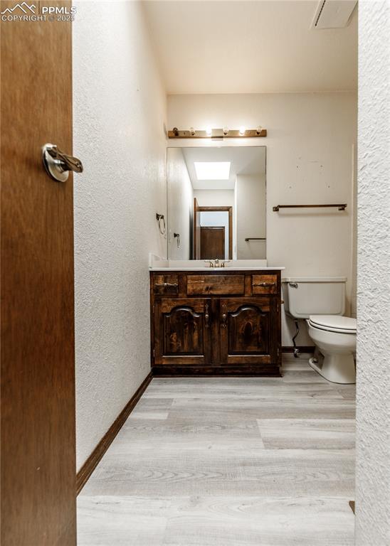 55 Bonnymede Road, Unit S Pueblo, CO 81001 - Photo 23 of 24 a bathroom with a sink and a mirror