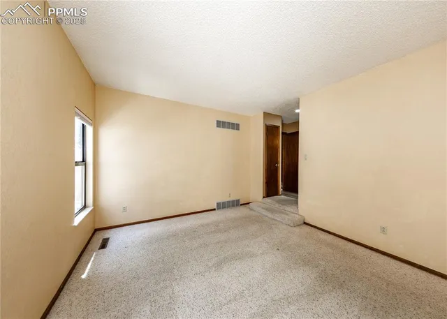 an empty room with windows