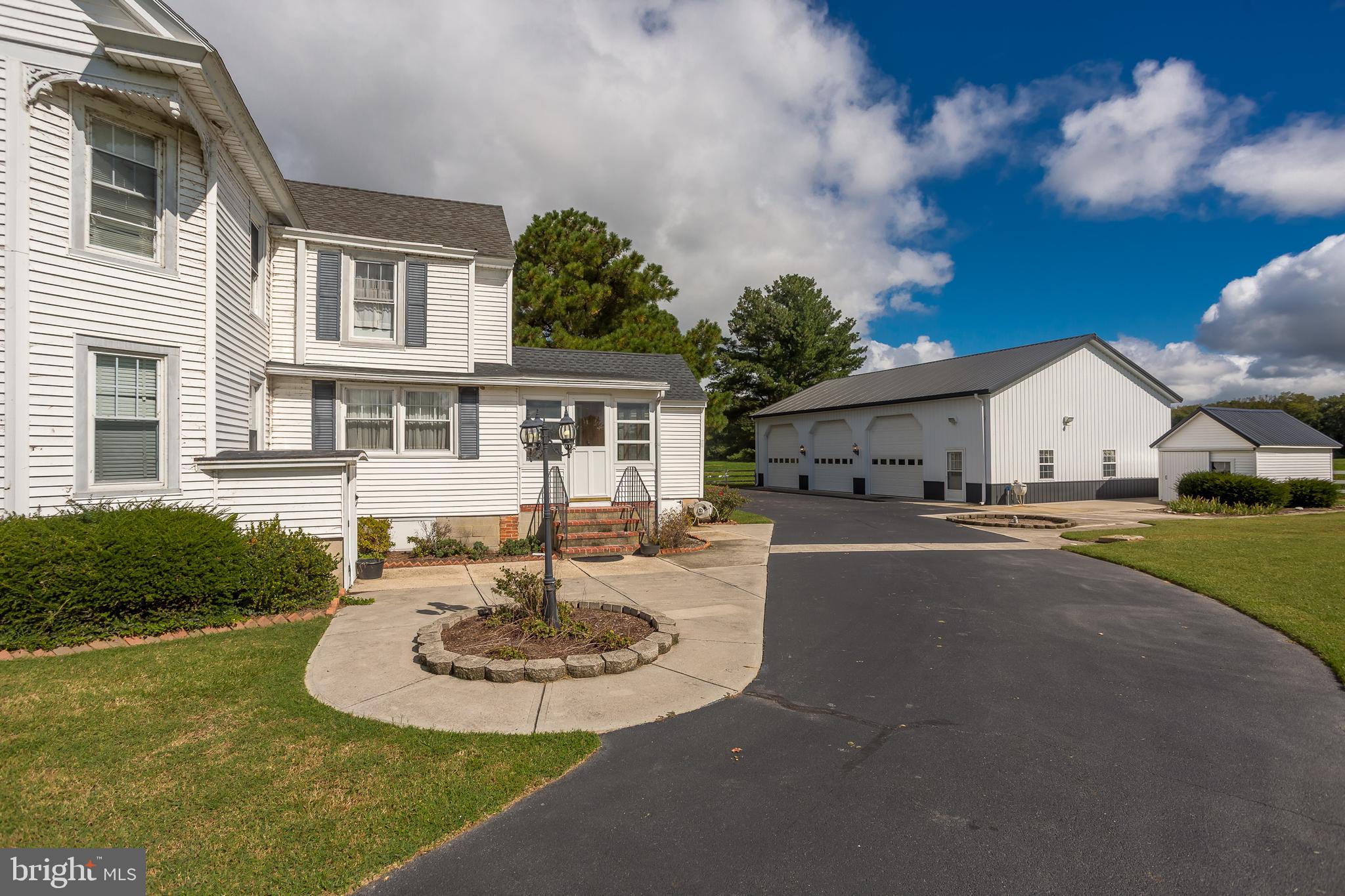 7751 Dividing Creek Road Pocomoke City, MD 21851 - Photo 15 of 51 a view of a house with pool and a yard