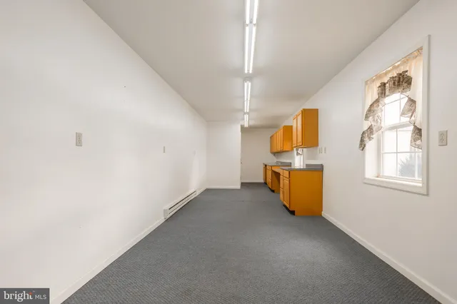 a kitchen with stainless steel appliances granite countertop a sink and a stove