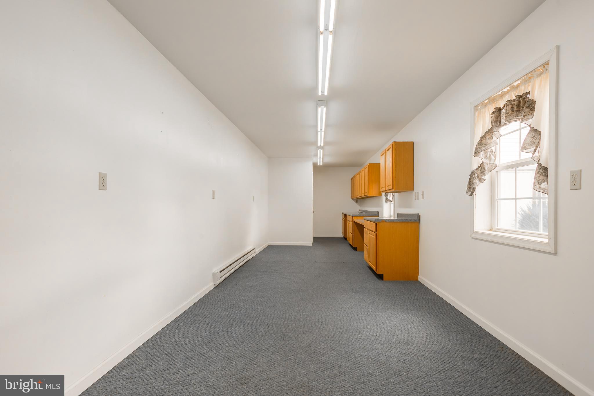 7751 Dividing Creek Road Pocomoke City, MD 21851 - Photo 20 of 51 a view of a room with wooden floor and staircase