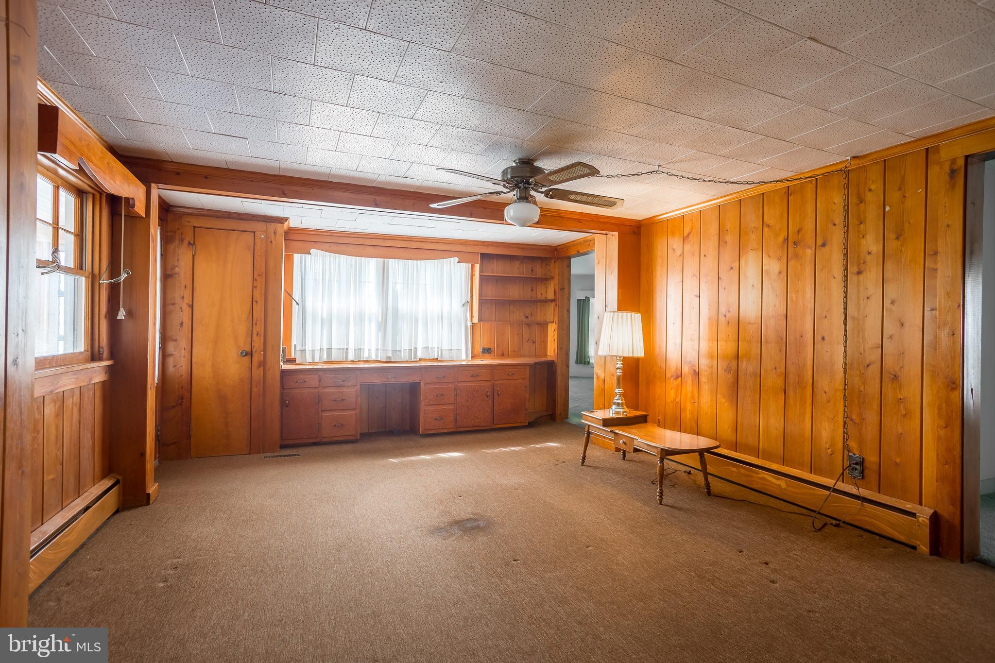 7751 Dividing Creek Road Pocomoke City, MD 21851 - Photo 32 of 51 a view of an empty room with a window