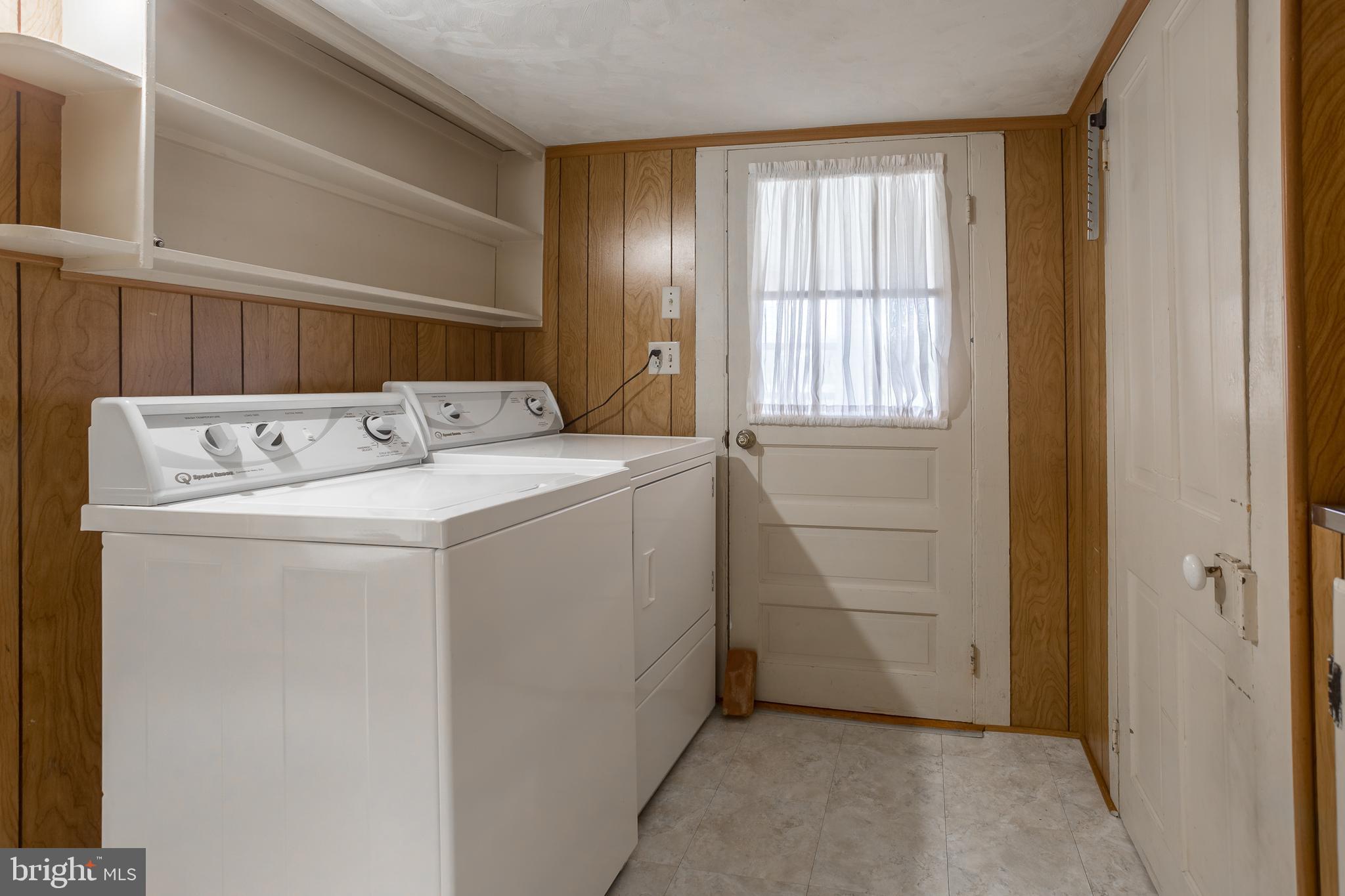 7751 Dividing Creek Road Pocomoke City, MD 21851 - Photo 42 of 51 a utility room with dryer and washer