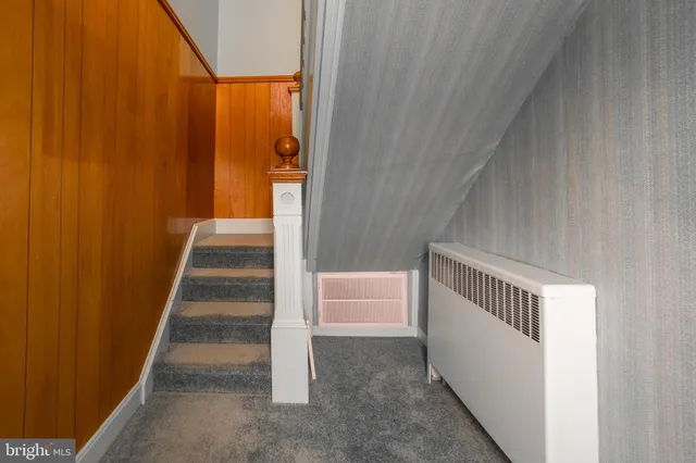 a stairs and a table in an empty room