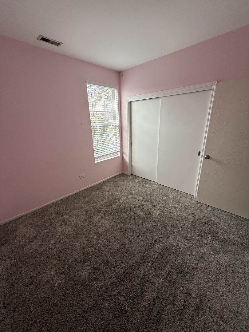 1586 Millbrook Drive Algonquin, IL 60102 - Photo 12 of 18 an empty room with windows