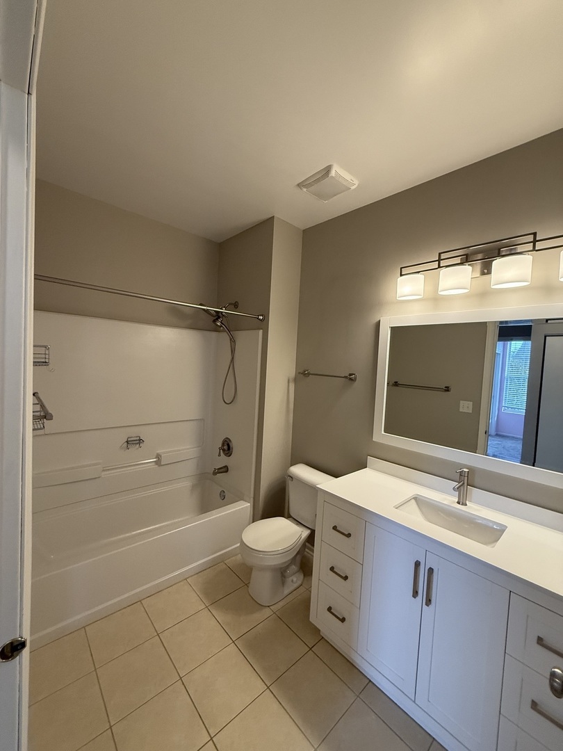 1586 Millbrook Drive Algonquin, IL 60102 - Photo 14 of 18 a spacious bathroom with a double vanity sink toilet mirror and shower