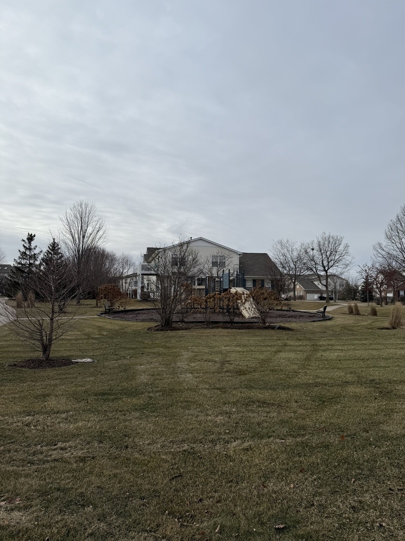 1586 Millbrook Drive Algonquin, IL 60102 - Photo 18 of 18 a car parked in the middle of a field