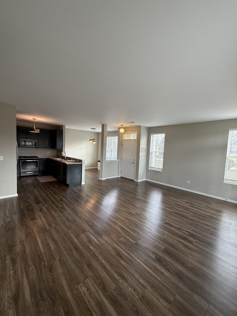 1586 Millbrook Drive Algonquin, IL 60102 - Photo 5 of 18 a view of livingroom with hardwood