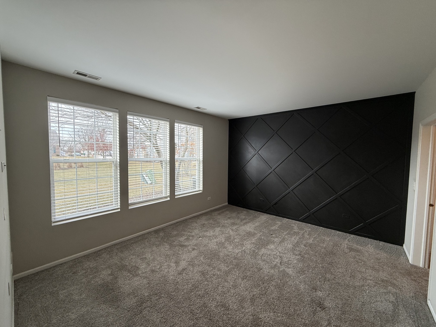 1586 Millbrook Drive Algonquin, IL 60102 - Photo 7 of 18 an empty room with a empty space and windows