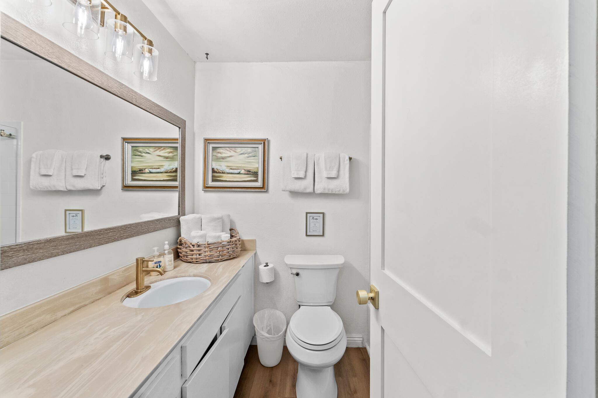 77 North Ocean Avenue, Unit 12 Cayucos, CA 93430 - Photo 27 of 41 a bathroom with a granite countertop toilet a sink and a mirror