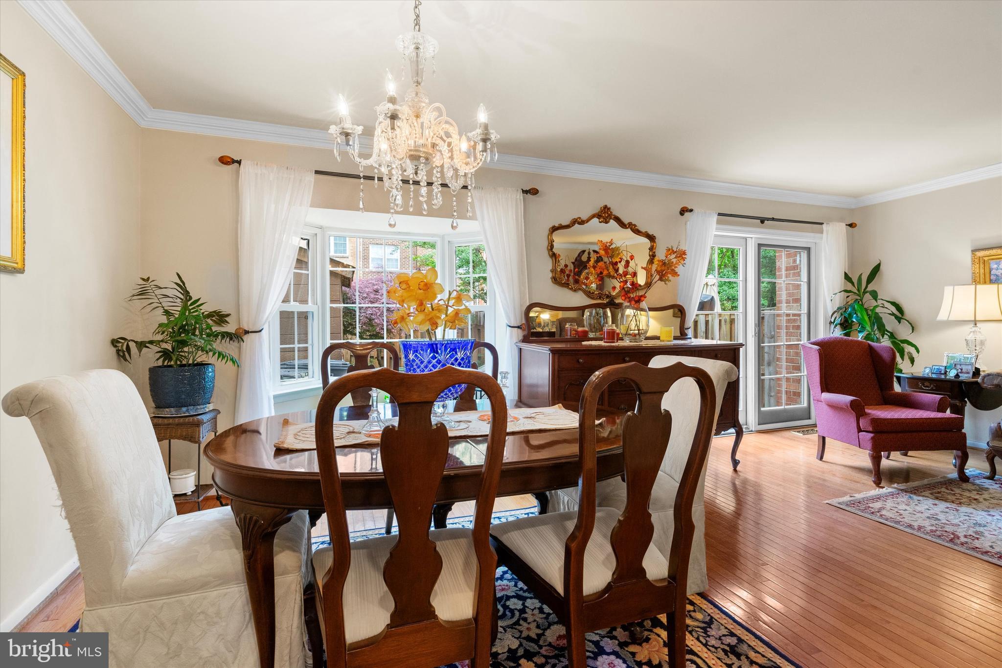 5504 Winford Court Fairfax, VA 22032 - Photo 17 of 61 a view of a dining room with furniture a chandelier and wooden floor
