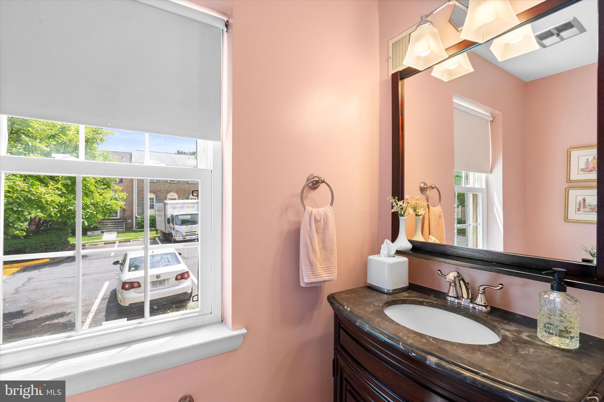 5504 Winford Court Fairfax, VA 22032 - Photo 24 of 61 a bathroom with a granite countertop sink mirror and a shower