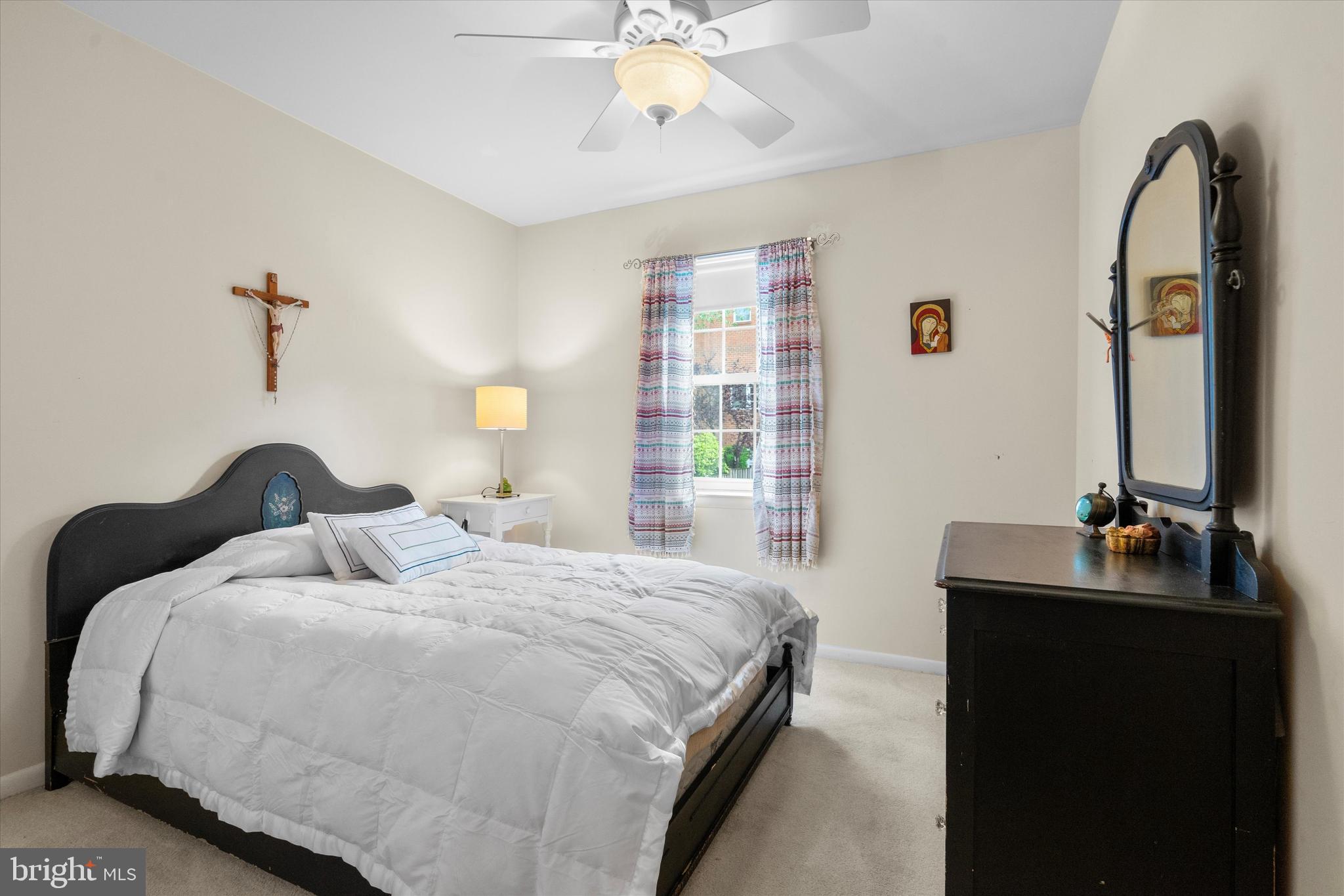 5504 Winford Court Fairfax, VA 22032 - Photo 30 of 61 a bedroom with a bed and a chandelier